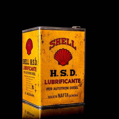 Vintage Shell oil cans with red and yellow branding from the 1900-1920 old logo Vintage Shell oil cans from 1900-19255, featuring the old logo. The photo showcases an antique tin red with yellow accents, displaying the historic Shell emblem. Shot in a studio against a solid black background