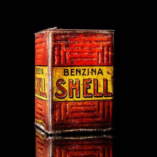 Vintage Shell oil cans with red and yellow branding from the 1900-1920 old logo Vintage Shell oil cans from 1900-19255, featuring the old logo. The photo showcases an antique tin red with yellow accents, displaying the historic Shell emblem. Shot in a studio against a solid black background