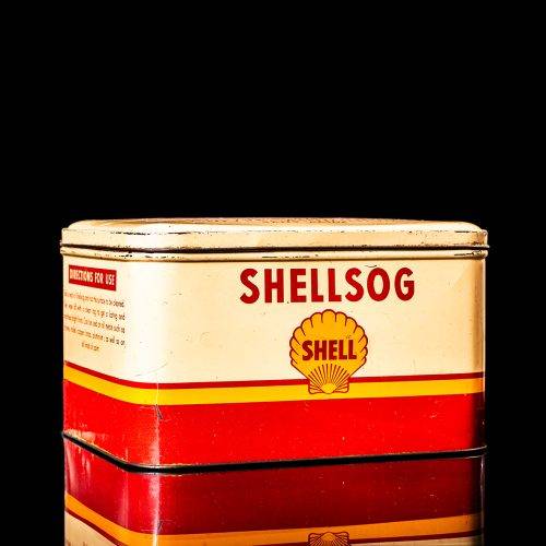 Vintage Shell oil cans with red and yellow branding from the 1900-1920 old logo Vintage Shell oil cans from 1900-19255, featuring the old logo. The photo showcases an antique tin red with yellow accents, displaying the historic Shell emblem. Shot in a studio against a solid black background