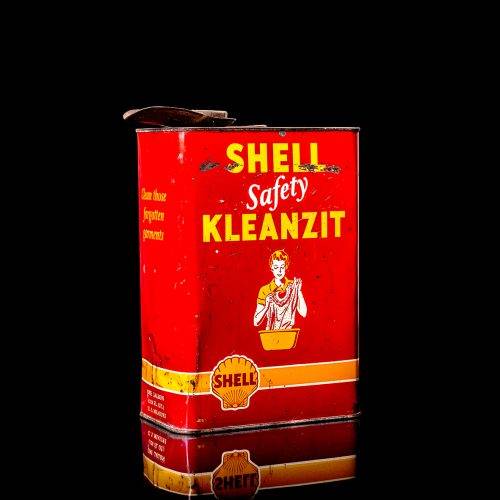 Vintage Shell oil cans with red and yellow branding from the 1900-1920 old logo Vintage Shell oil cans from 1900-19255, featuring the old logo. The photo showcases an antique tin red with yellow accents, displaying the historic Shell emblem. Shot in a studio against a solid black background