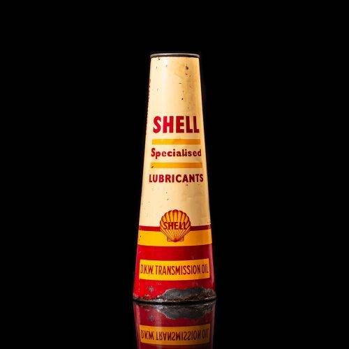 Rare and unique vintage conical shell oil can from 1900–1950 with a red base and yellow accents, featuring the classic shell logo. This antique, cone-shaped motor oil tin is showcased in a studio setting against a solid black background.