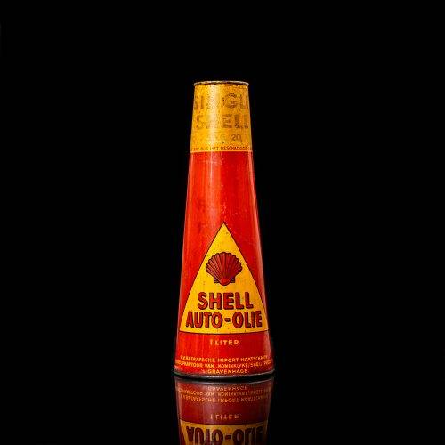 Vintage Shell oil cans with red and yellow branding from the 1900-1920 old logo Vintage Shell oil cans from 1900-19255, featuring the old logo. The photo showcases an antique tin red with yellow accents, displaying the historic Shell emblem. Shot in a studio against a solid black background