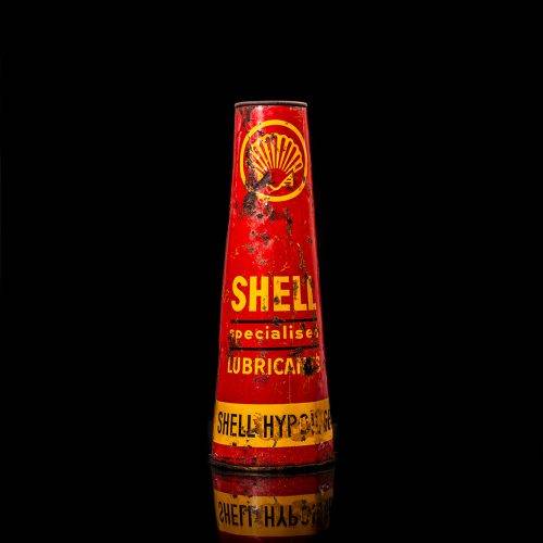 Vintage Shell oil cans with red and yellow branding from the 1900-1920 old logo Vintage Shell oil cans from 1900-19255, featuring the old logo. The photo showcases an antique tin red with yellow accents, displaying the historic Shell emblem. Shot in a studio against a solid black background