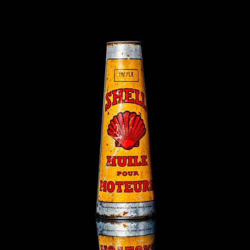Vintage Shell oil cans with red and yellow branding from the 1900-1920 old logo Vintage Shell oil cans from 1900-19255, featuring the old logo. The photo showcases an antique tin red with yellow accents, displaying the historic Shell emblem. Shot in a studio against a solid black background