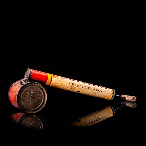 Rare and unique vintage Shell flitgun from 1900–1950 with a red base and yellow accents, featuring the classic Shell logo. This antique insect spray canister is displayed in a studio setting against a solid black background