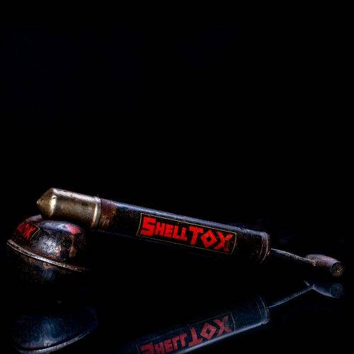 Vintage Shell oil cans with red and yellow branding from the 1900-1920 old logo Vintage Shell oil cans from 1900-19255, featuring the old logo. The photo showcases an antique tin red with yellow accents, displaying the historic Shell emblem. Shot in a studio against a solid black background