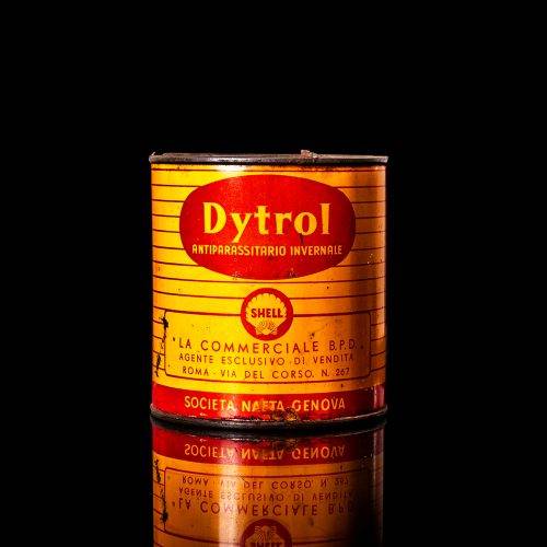 Rare and unique vintage Shell grease can from 1900–1950 with a red base and yellow detailing, featuring the classic Shell logo. This antique lubricant tin is displayed in a studio setting against a solid black background."