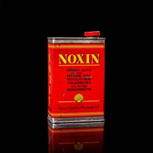 Rare and unique vintage mini Shell oil can from 1900–1950 with red and yellow accents, featuring the classic Shell logo. This small antique tin is displayed in a studio setting against a solid black background. lubricant,cleaner, outboard, motor oil, sealant, valve lubricant, two cycle, glass cleaner oil, shell cans