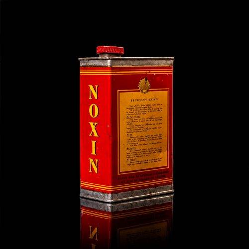 Rare and unique vintage mini Shell oil can from 1900–1950 with red and yellow accents, featuring the classic Shell logo. This small antique tin is displayed in a studio setting against a solid black background. lubricant,cleaner, outboard, motor oil, sealant, valve lubricant, two cycle, glass cleaner oil, shell cans