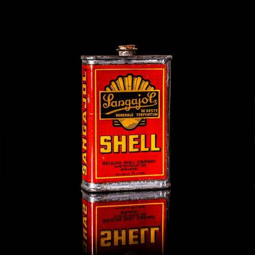 Vintage Shell oil cans with red and yellow branding from the 1900-1920 old logo Vintage Shell oil cans from 1900-19255, featuring the old logo. The photo showcases an antique tin red with yellow accents, displaying the historic Shell emblem. Shot in a studio against a solid black background