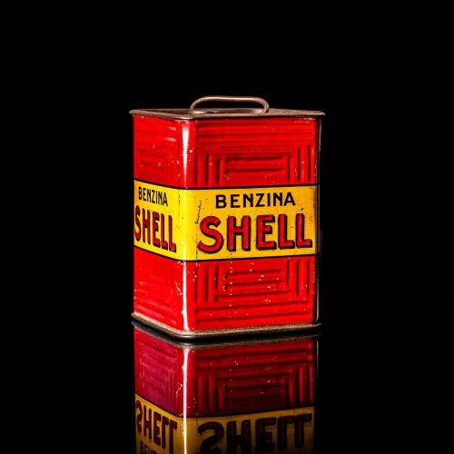 Vintage Shell oil cans with red and yellow branding from the 1900-1920 old logo Vintage Shell oil cans from 1900-19255, featuring the old logo. The photo showcases an antique tin red with yellow accents, displaying the historic Shell emblem. Shot in a studio against a solid black background