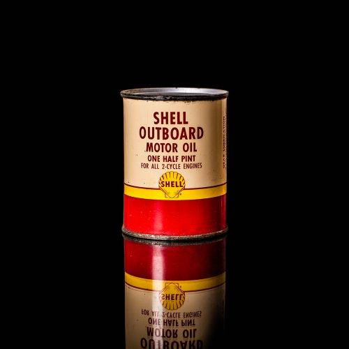 Rare and unique vintage mini Shell oil can from 1900–1950 with red and yellow accents, featuring the classic Shell logo. This small antique tin is displayed in a studio setting against a solid black background." lubricant,cleaner, outboard, motor oil, sealant, valve lubricant, two cycle, glass cleaner oil, shell cans