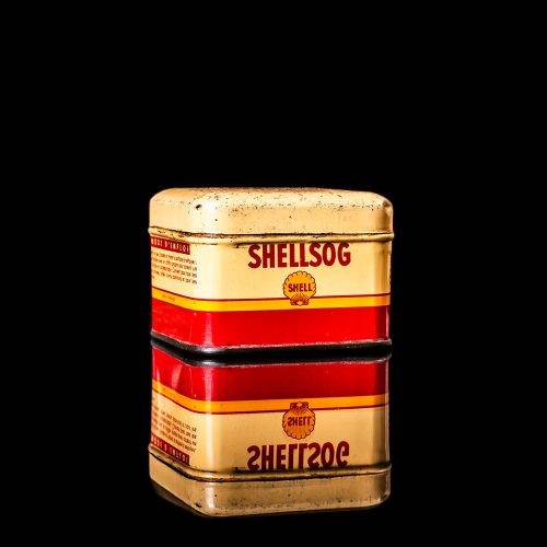 Rare and unique vintage mini Shell oil can from 1900–1950 with red and yellow accents, featuring the classic Shell logo. This small antique tin is displayed in a studio setting against a solid black background." lubricant,cleaner, outboard, motor oil, sealant, valve lubricant, two cycle, glass cleaner oil, shell cans