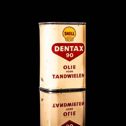 Vintage Shell oil cans with red and yellow branding from the 1900-1920 old logo Vintage Shell oil cans from 1900-19255, featuring the old logo. The photo showcases an antique tin red with yellow accents, displaying the historic Shell emblem. Shot in a studio against a solid black background
