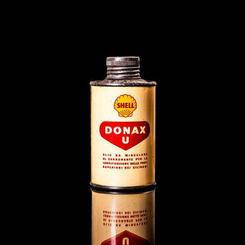 Rare and unique vintage mini Shell oil can from 1900–1950 with red and yellow accents, featuring the classic Shell logo. This small antique tin is displayed in a studio setting against a solid black background." lubricant,cleaner, outboard, motor oil, sealant, valve lubricant, two cycle, glass cleaner oil, shell cans