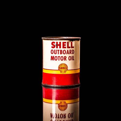Rare and unique vintage mini Shell oil can from 1900–1950 with red and yellow accents, featuring the classic Shell logo. This small antique tin is displayed in a studio setting against a solid black background." lubricant,cleaner, outboard, motor oil, sealant, valve lubricant, two cycle, glass cleaner oil, shell cans