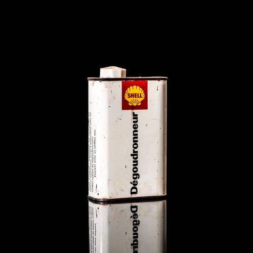 Rare and unique vintage mini Shell oil can from 1900–1950 with red and yellow accents, featuring the classic Shell logo. This small antique tin is displayed in a studio setting against a solid black background." lubricant,cleaner, outboard, motor oil, sealant, valve lubricant, two cycle, glass cleaner oil, shell cans