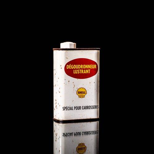 Rare and unique vintage mini Shell oil can from 1900–1950 with red and yellow accents, featuring the classic Shell logo. This small antique tin is displayed in a studio setting against a solid black background." lubricant,cleaner, outboard, motor oil, sealant, valve lubricant, two cycle, glass cleaner oil, shell cans