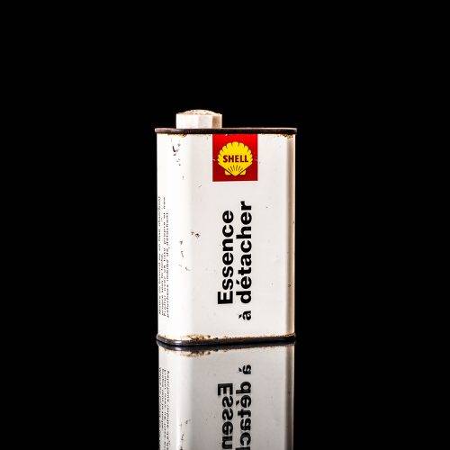 Rare and unique vintage mini Shell oil can from 1900–1950 with red and yellow accents, featuring the classic Shell logo. This small antique tin is displayed in a studio setting against a solid black background." lubricant,cleaner, outboard, motor oil, sealant, valve lubricant, two cycle, glass cleaner oil, shell cans