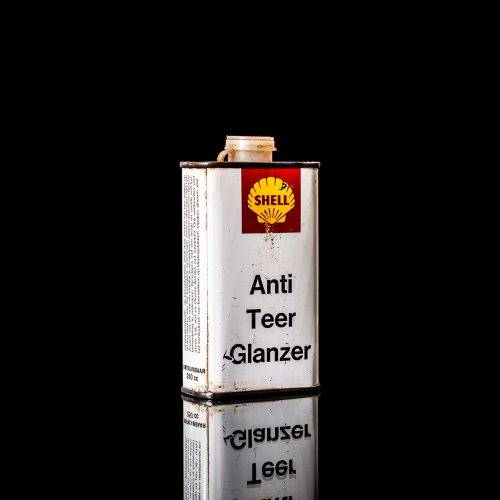 Rare and unique vintage mini Shell oil can from 1900–1950 with red and yellow accents, featuring the classic Shell logo. This small antique tin is displayed in a studio setting against a solid black background." lubricant,cleaner, outboard, motor oil, sealant, valve lubricant, two cycle, glass cleaner oil, shell cans