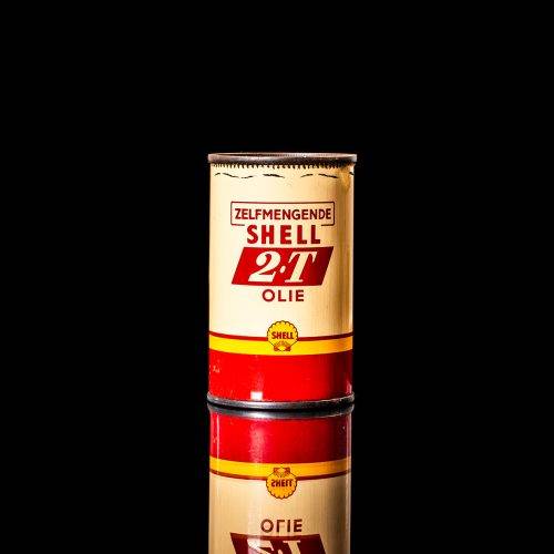 Vintage Shell oil cans with red and yellow branding from the 1900-1920 old logo Vintage Shell oil cans from 1900-19255, featuring the old logo. The photo showcases an antique tin red with yellow accents, displaying the historic Shell emblem. Shot in a studio against a solid black background
