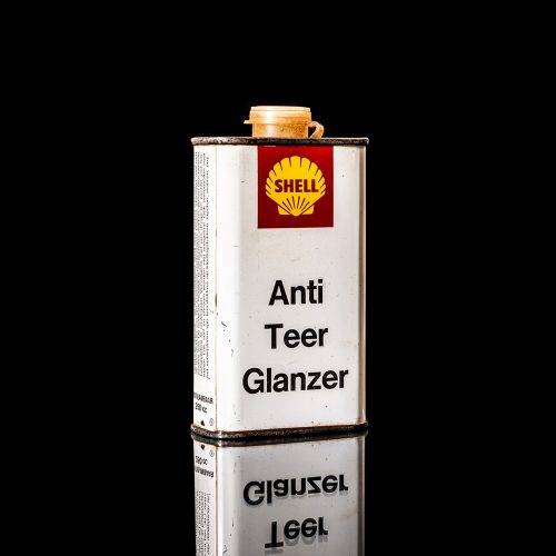 Rare and unique vintage mini Shell oil can from 1900–1950 with red and yellow accents, featuring the classic Shell logo. This small antique tin is displayed in a studio setting against a solid black background." lubricant,cleaner, outboard, motor oil, sealant, valve lubricant, two cycle, glass cleaner oil, shell cans