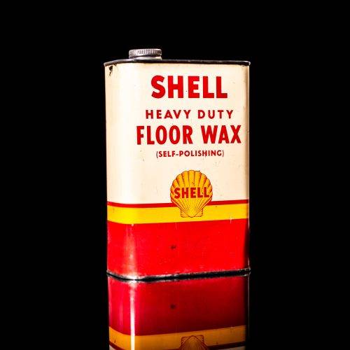 Rare and unique vintage mini Shell oil can from 1900–1950 with red and yellow accents, featuring the classic Shell logo. This small antique tin is displayed in a studio setting against a solid black background." lubricant,cleaner, outboard, motor oil, sealant, valve lubricant, two cycle, glass cleaner oil, shell cans