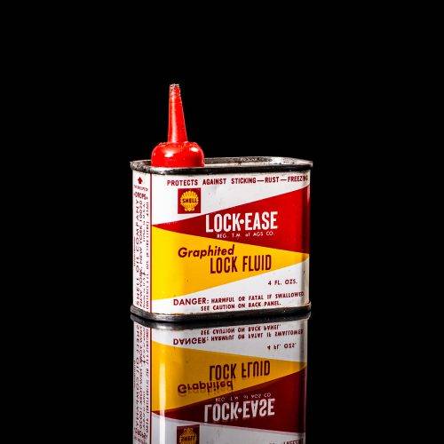 Rare and unique vintage mini Shell oil can Handy oil from 1900–1950 with red and yellow accents, featuring the classic Shell logo. This small antique tin is displayed in a studio setting against a solid black background." Handy oil cans