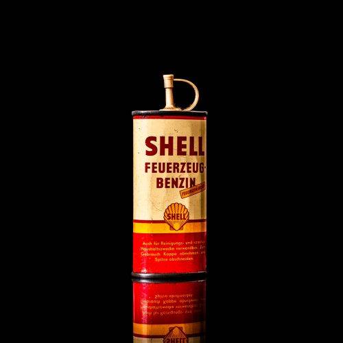 Vintage Shell oil cans with red and yellow branding from the 1900-1920 old logo Vintage Shell oil cans from 1900-19255, featuring the old logo. The photo showcases an antique tin red with yellow accents, displaying the historic Shell emblem. Shot in a studio against a solid black background