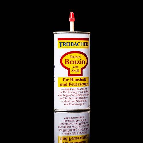 Vintage Shell oil cans with red and yellow branding from the 1900-1920 old logo Vintage Shell oil cans from 1900-19255, featuring the old logo. The photo showcases an antique tin red with yellow accents, displaying the historic Shell emblem. Shot in a studio against a solid black background