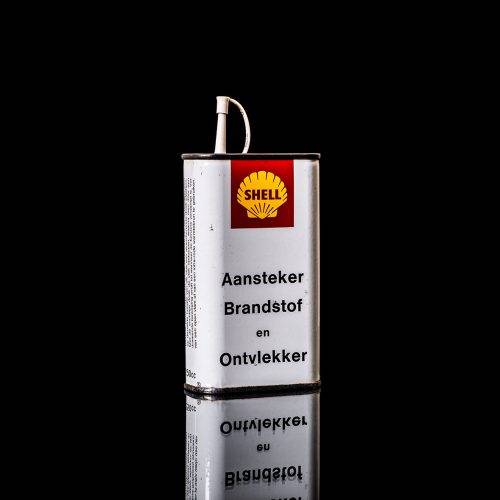 Rare and unique vintage mini Shell oil can from 1900–1950 with red and yellow accents, featuring the classic Shell logo. This small antique tin is displayed in a studio setting against a solid black background." lighter fluid shell cans