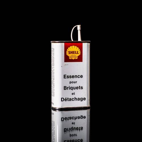 Vintage Shell oil cans with red and yellow branding from the 1900-1920 old logo Vintage Shell oil cans from 1900-19255, featuring the old logo. The photo showcases an antique tin red with yellow accents, displaying the historic Shell emblem. Shot in a studio against a solid black background