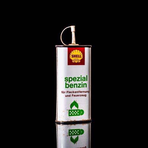 Rare and unique vintage mini Shell oil can from 1900–1950 with red and yellow accents, featuring the classic Shell logo. This small antique tin is displayed in a studio setting against a solid black background." lighter fluid shell cans