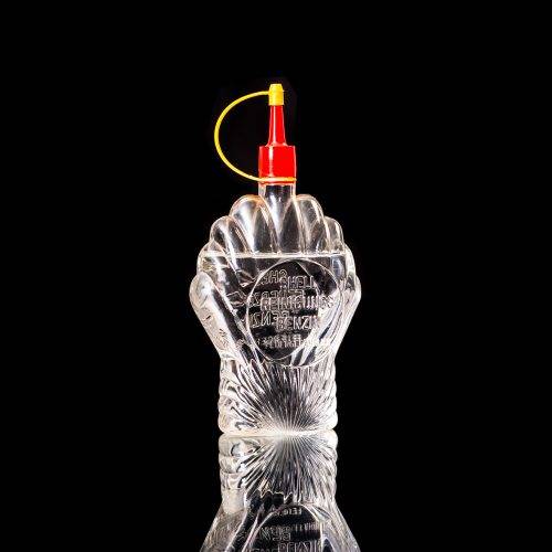 Rare and unique vintage mini Shell oil can from 1900–1950 with red and yellow accents, featuring the classic Shell logo. This small antique tin is displayed in a studio setting against a solid black background." lighter fluid shell cans