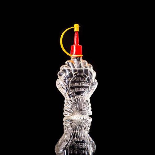 Vintage Shell oil cans with red and yellow branding from the 1900-1920 old logo Vintage Shell oil cans from 1900-19255, featuring the old logo. The photo showcases an antique tin red with yellow accents, displaying the historic Shell emblem. Shot in a studio against a solid black background