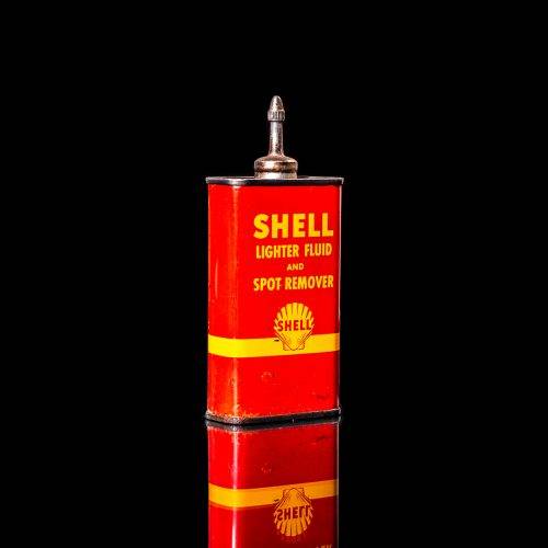Vintage Shell oil cans with red and yellow branding from the 1900-1920 old logo Vintage Shell oil cans from 1900-19255, featuring the old logo. The photo showcases an antique tin red with yellow accents, displaying the historic Shell emblem. Shot in a studio against a solid black background