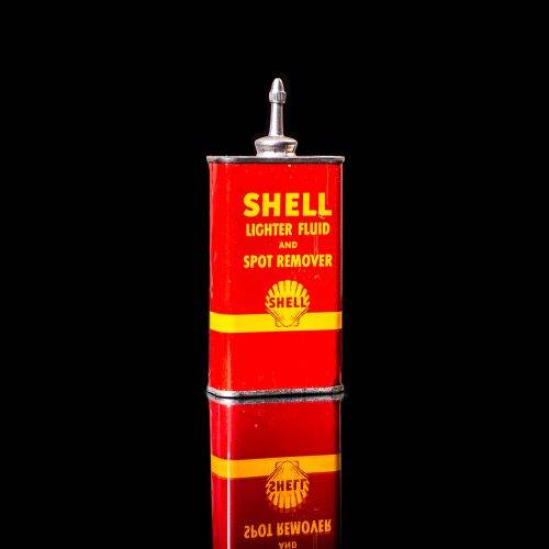 Vintage Shell oil cans with red and yellow branding from the 1900-1920 old logo Vintage Shell oil cans from 1900-19255, featuring the old logo. The photo showcases an antique tin red with yellow accents, displaying the historic Shell emblem. Shot in a studio against a solid black background
