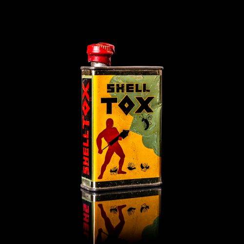 Vintage Shell oil cans with red and yellow branding from the 1900-1920 old logo Vintage Shell oil cans from 1900-19255, featuring the old logo. The photo showcases an antique tin red with yellow accents, displaying the historic Shell emblem. Shot in a studio against a solid black background
