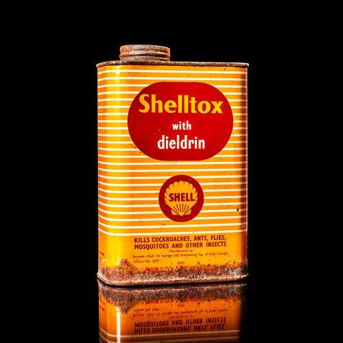 Vintage Shell oil cans with red and yellow branding from the 1900-1920 old logo Vintage Shell oil cans from 1900-19255, featuring the old logo. The photo showcases an antique tin red with yellow accents, displaying the historic Shell emblem. Shot in a studio against a solid black background