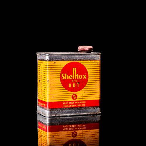 Vintage Shell oil cans with red and yellow branding from the 1900-1920 old logo Vintage Shell oil cans from 1900-19255, featuring the old logo. The photo showcases an antique tin red with yellow accents, displaying the historic Shell emblem. Shot in a studio against a solid black background