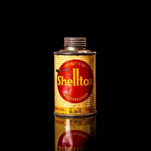 Vintage Shell oil cans with red and yellow branding from the 1900-1920 old logo Vintage Shell oil cans from 1900-19255, featuring the old logo. The photo showcases an antique tin red with yellow accents, displaying the historic Shell emblem. Shot in a studio against a solid black background