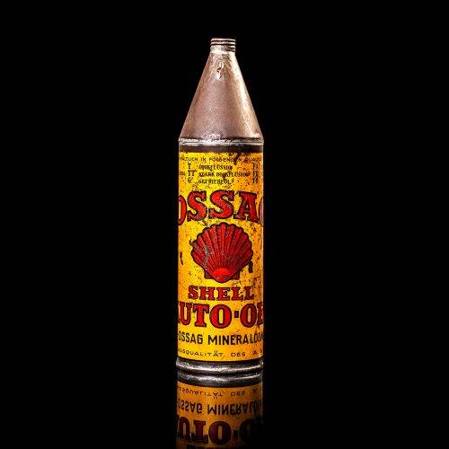 Vintage Shell oil cans with red and yellow branding from the 1920-1940 old logo Vintage Shell oil cans from 1900-1920, featuring the old logo. The photo showcases an antique tin yellow with red accenaccents, displaying the historic Shell emblem. Shot in a studio against a solid black background